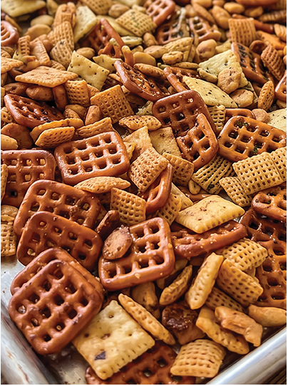 snack mixture with pretzels, crackers, and chex mix