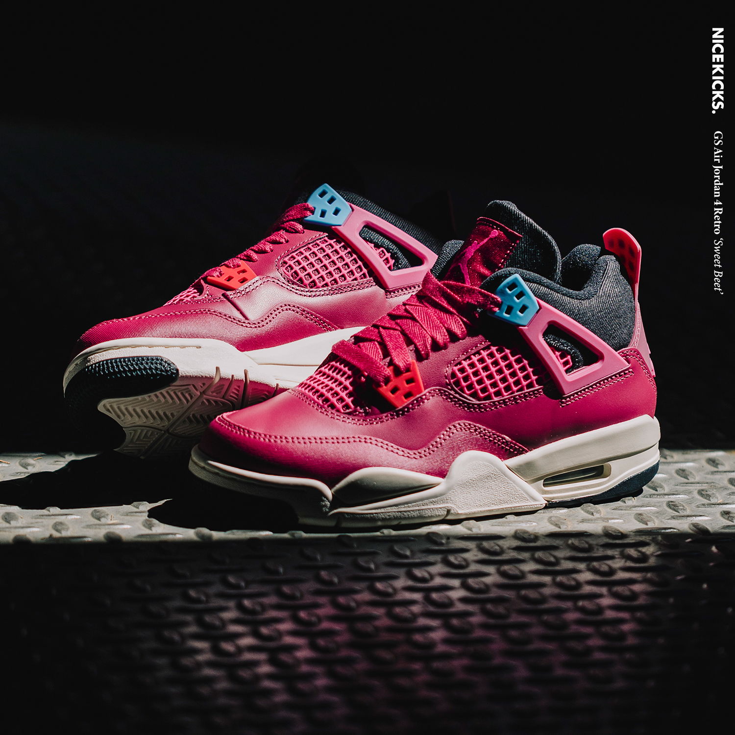 A pair of red and black Air Jordan 4 sneakers on a surface.