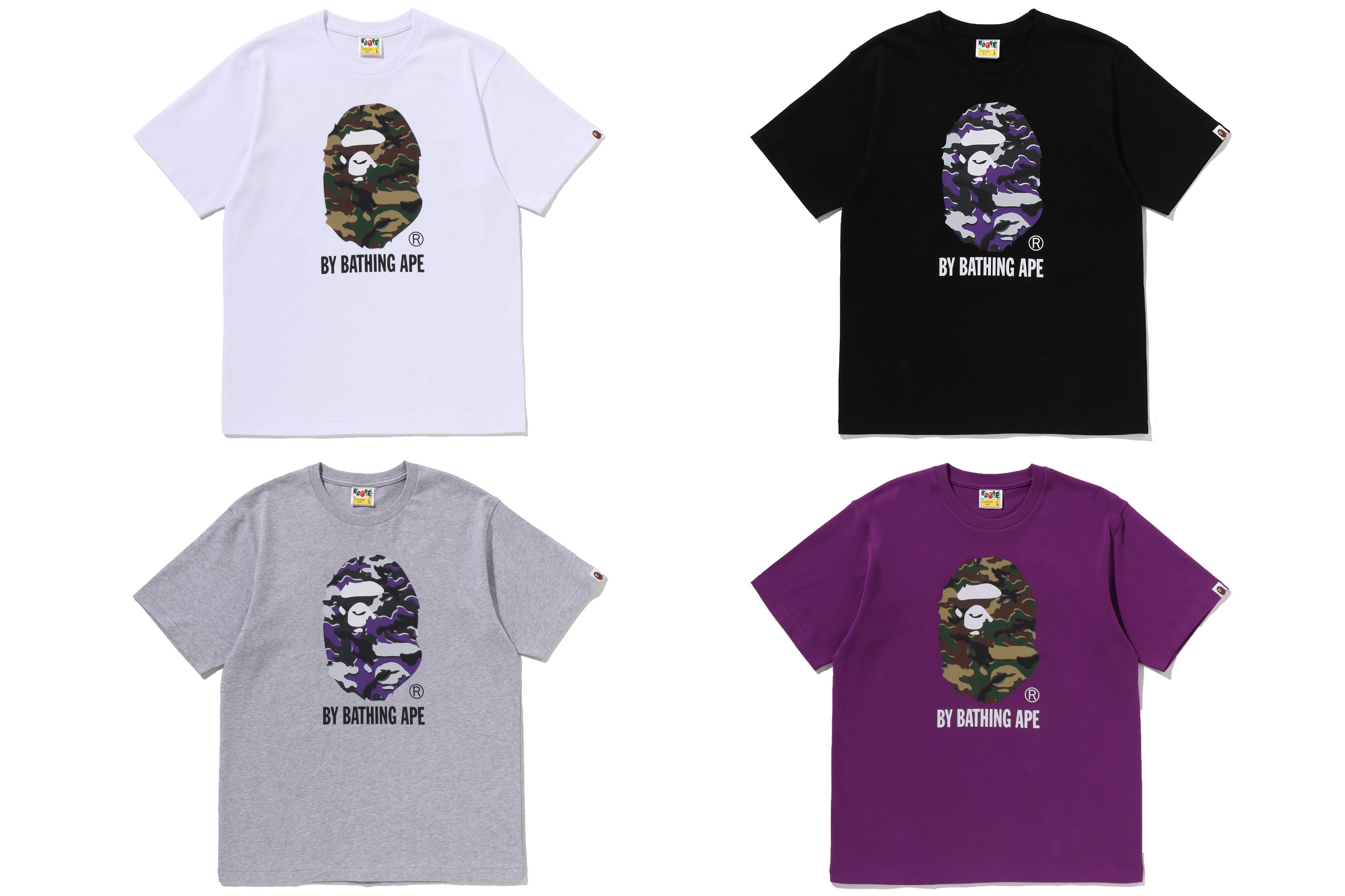 Four t-shirts in different colors featuring graphic designs.