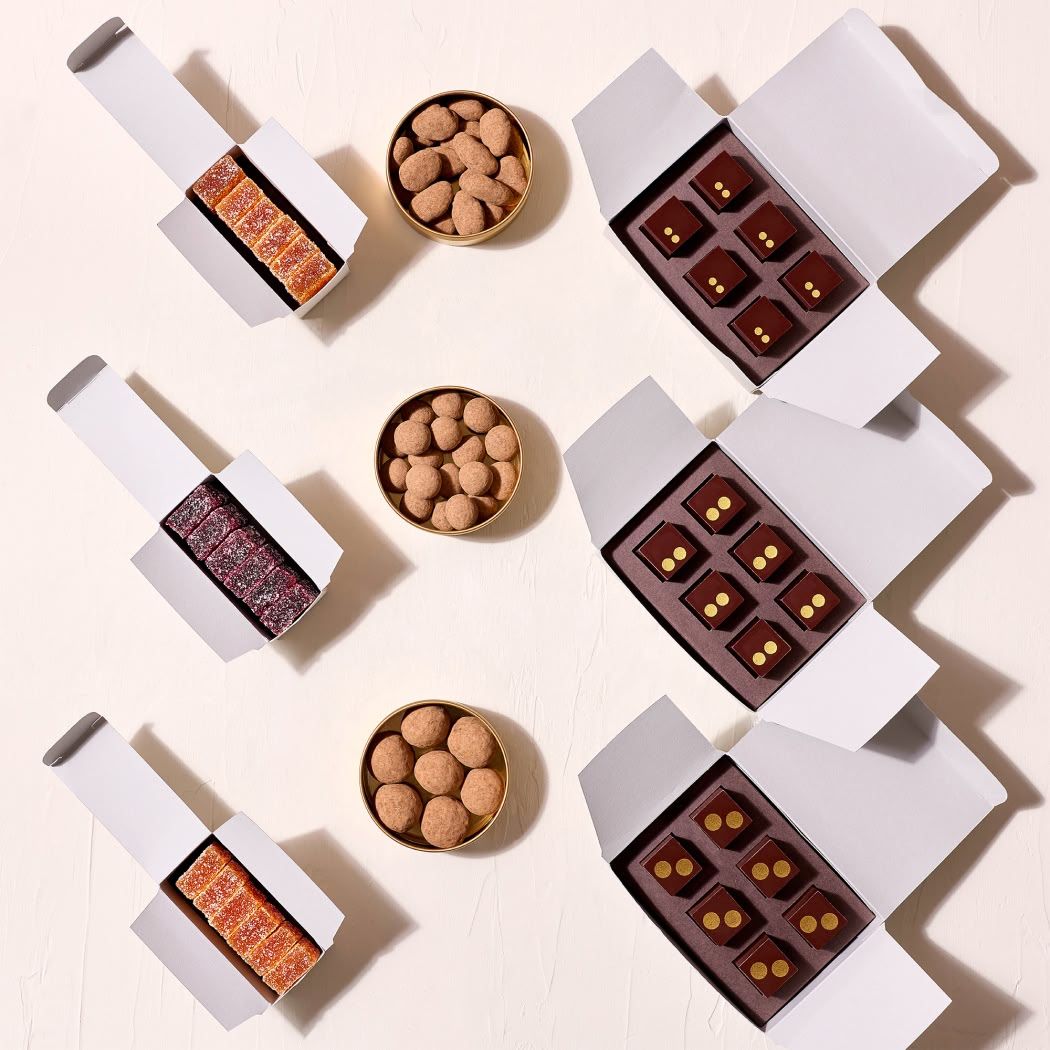 Desserts displayed on a white surface with decorative elements.