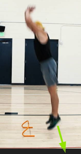 athlete pushing feet into ground to jump start