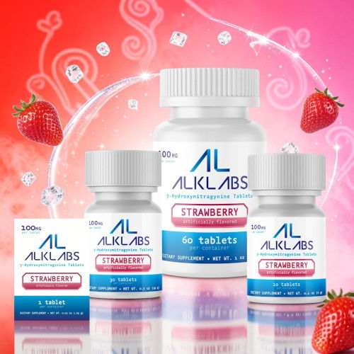 Bottles of ALKLABS strawberry tablets with strawberries on a pink background.