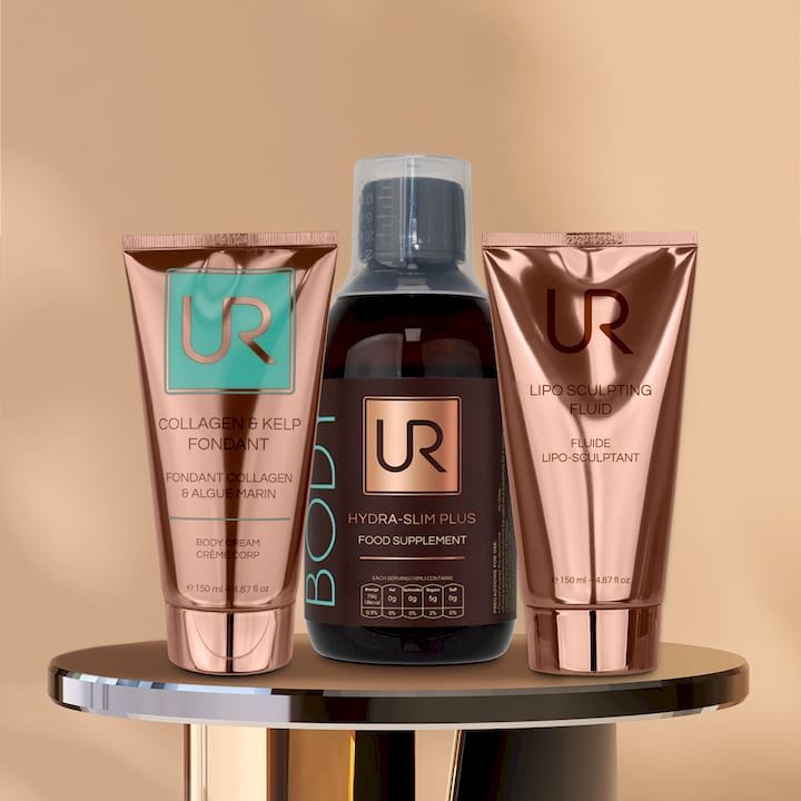 Urban Retreat body care products displayed on a pedestal against a beige background.