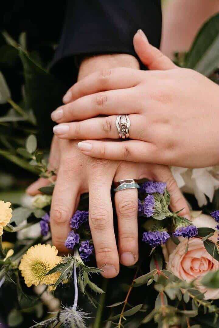 Wedding photo of wood and turquoise wedding band and diamond ring