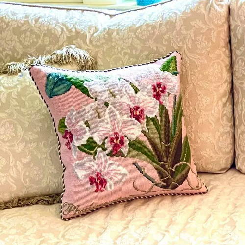 Finished orchid needlepoint pillow with pale rose background