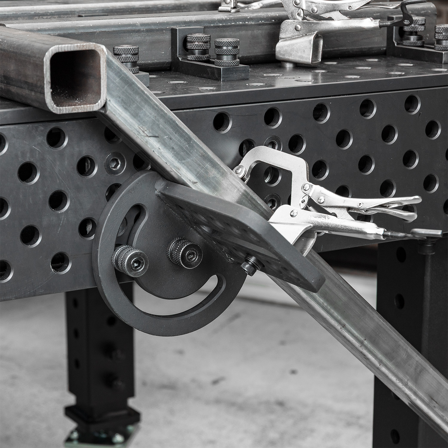 Metalworking tools and equipment on a workbench.