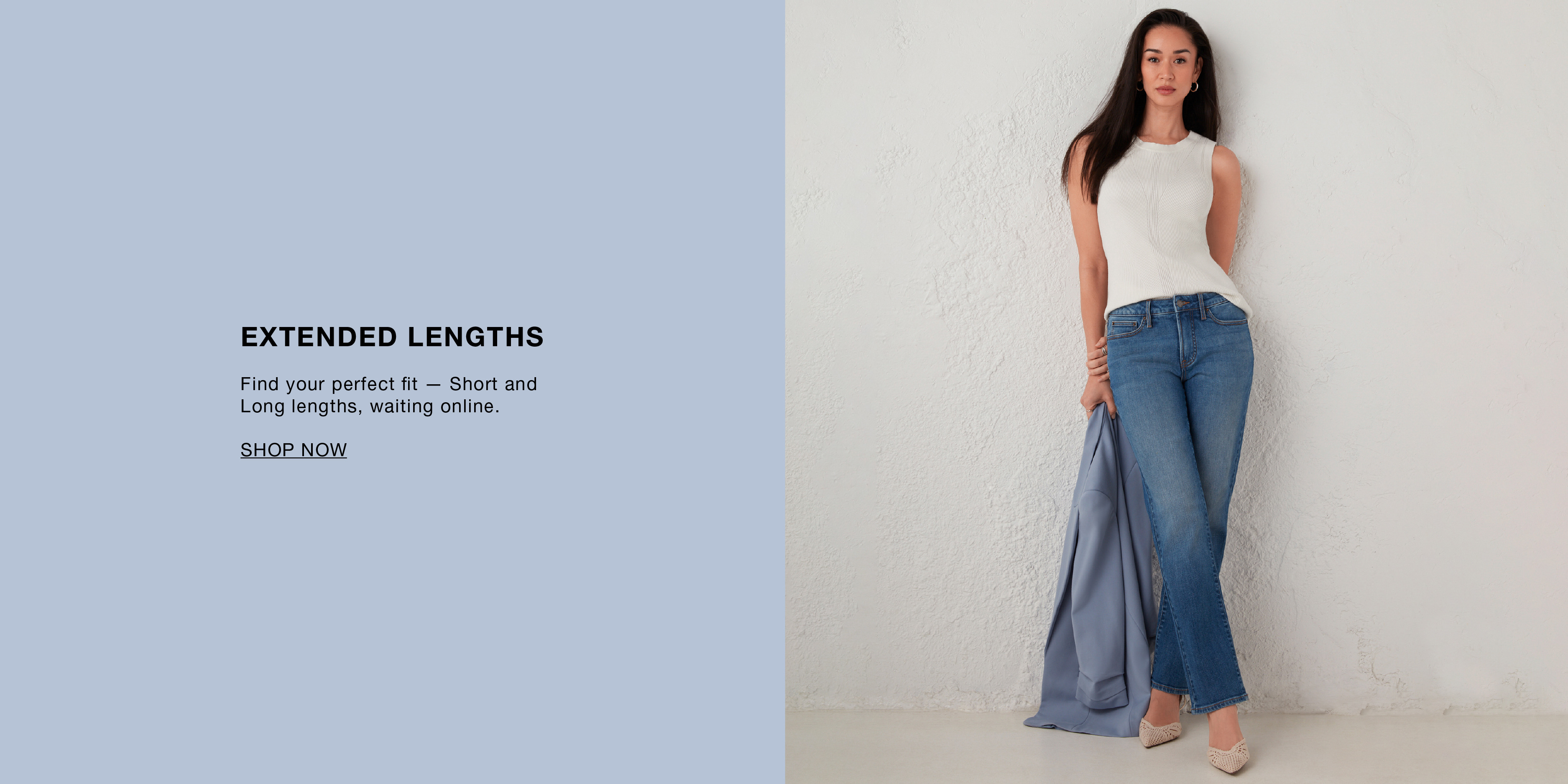 Model wearing a white top and wide-leg jeans against a light background.