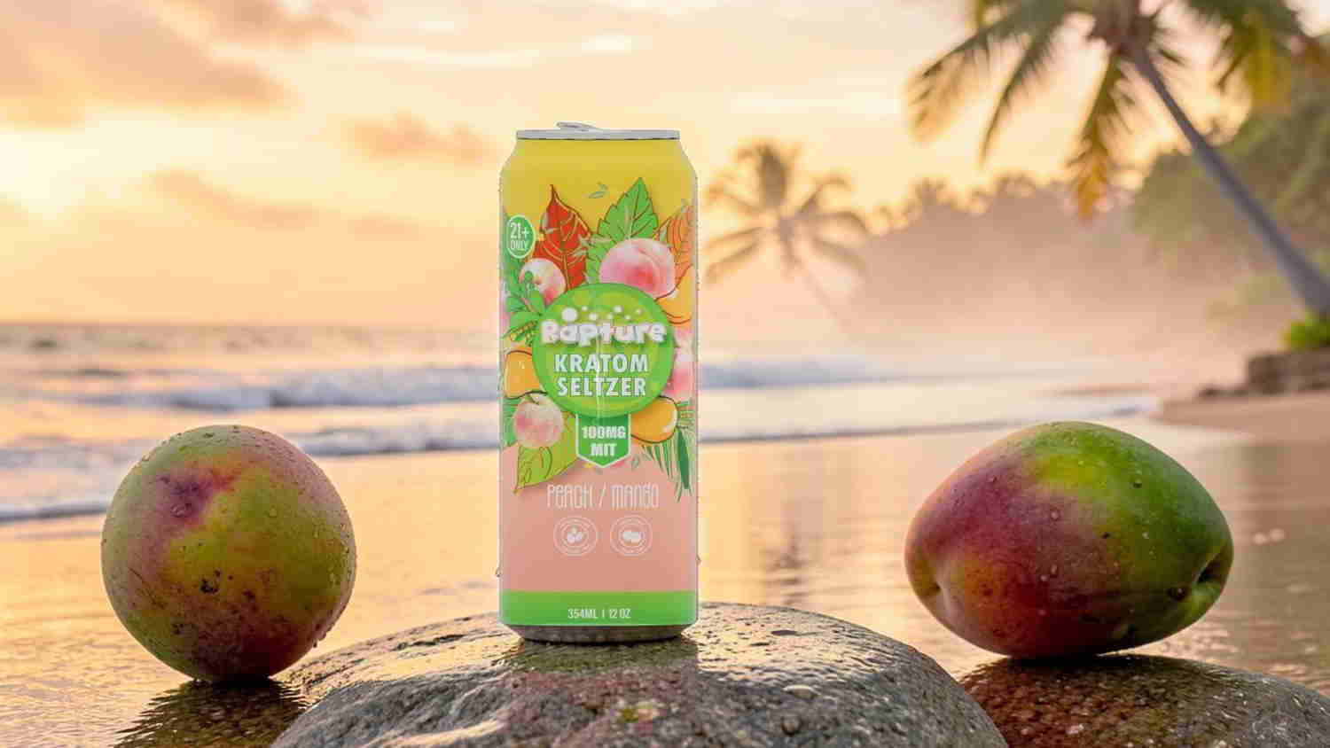 A can of beverage surrounded by mangoes on a beach at sunset.