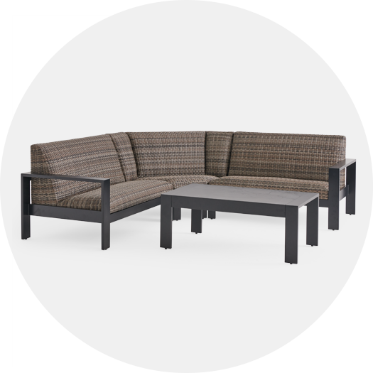 Corner sofa with cushions and a matching coffee table.