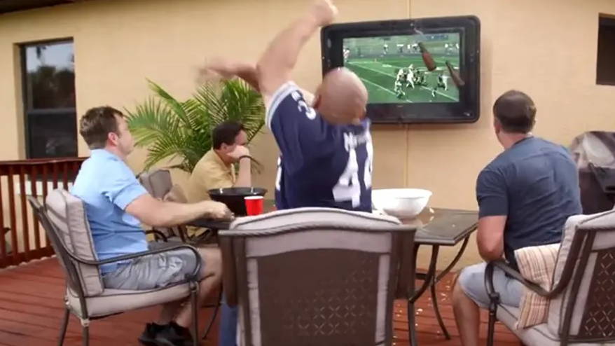 People throwing food at TV screen protection box for backyard 