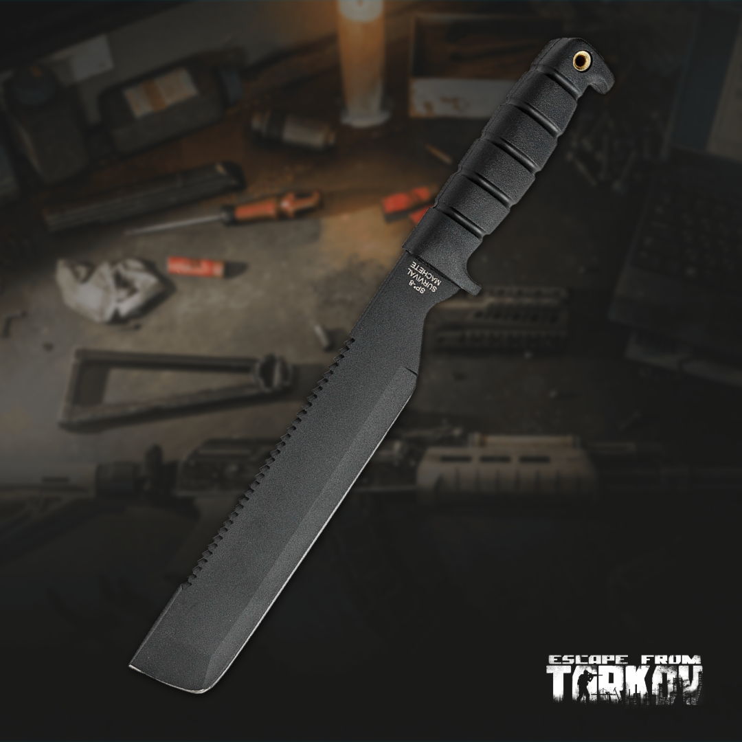 Black tactical knife on a surface with various items in the background.