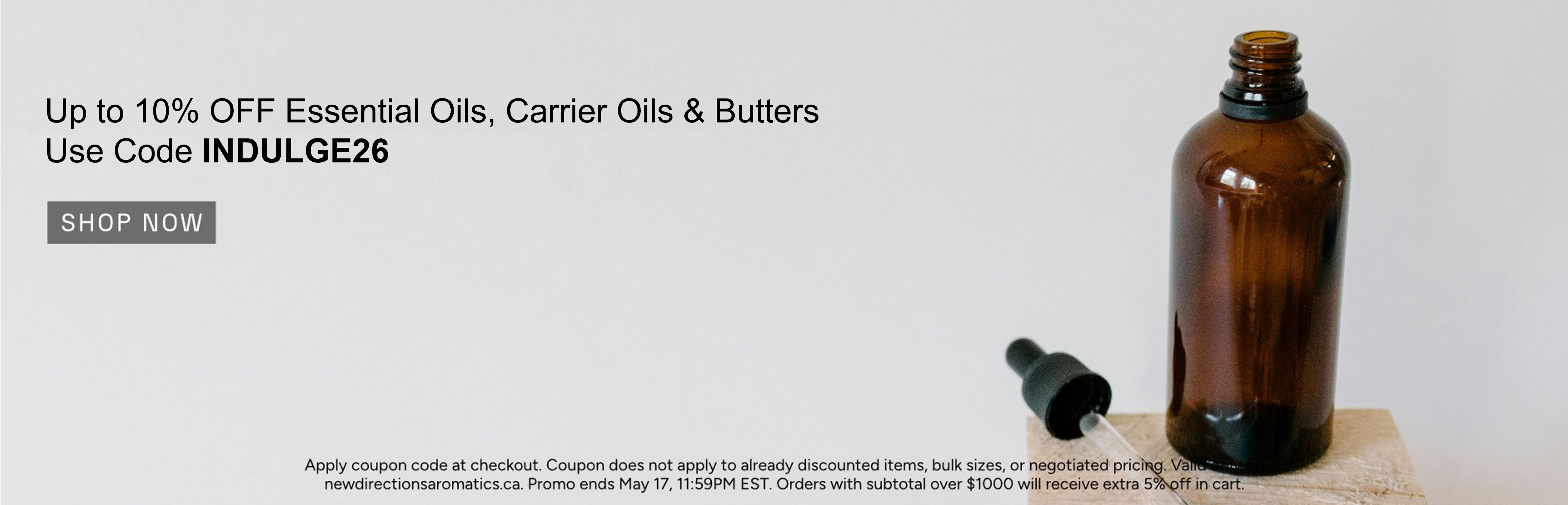 Amber bottle with dropper, promoting discounts on essential oils and carrier oils.