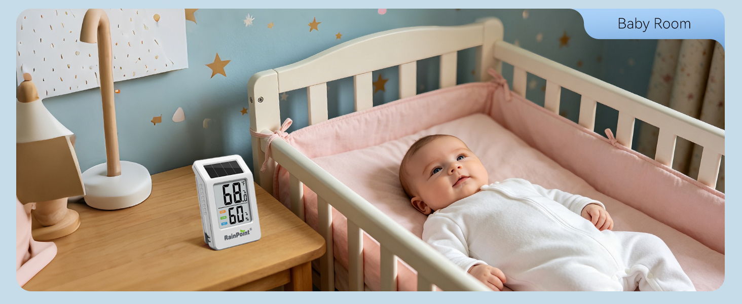 A baby lying in a crib with a monitor and lamp nearby.