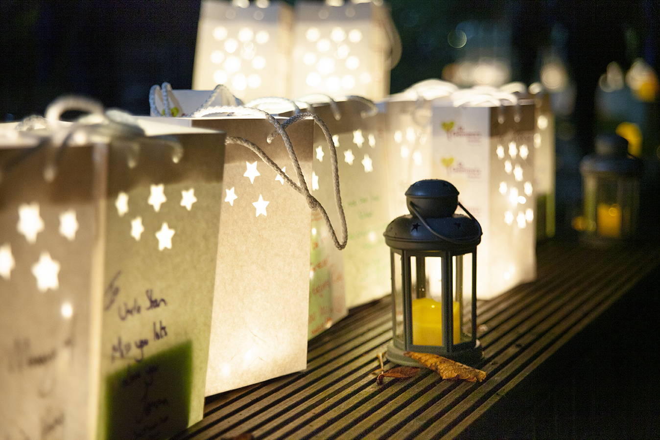 Handmade paper lanterns with micro lights inside in remembrance of loved ones. 