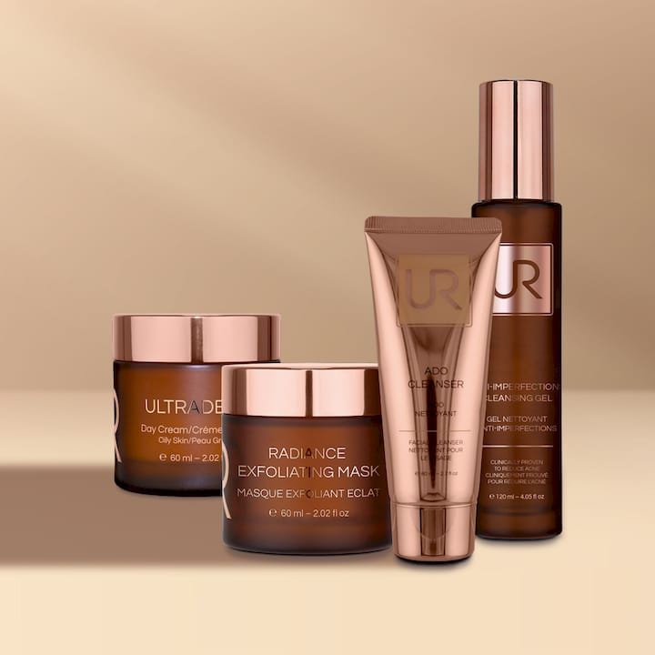 Urban Retreat skincare products with rose gold packaging on a beige background.