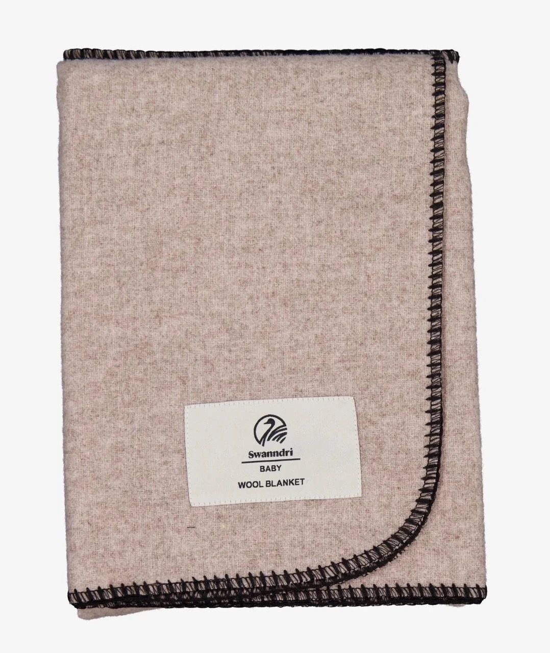 A folded wool blanket with a label and decorative stitching.