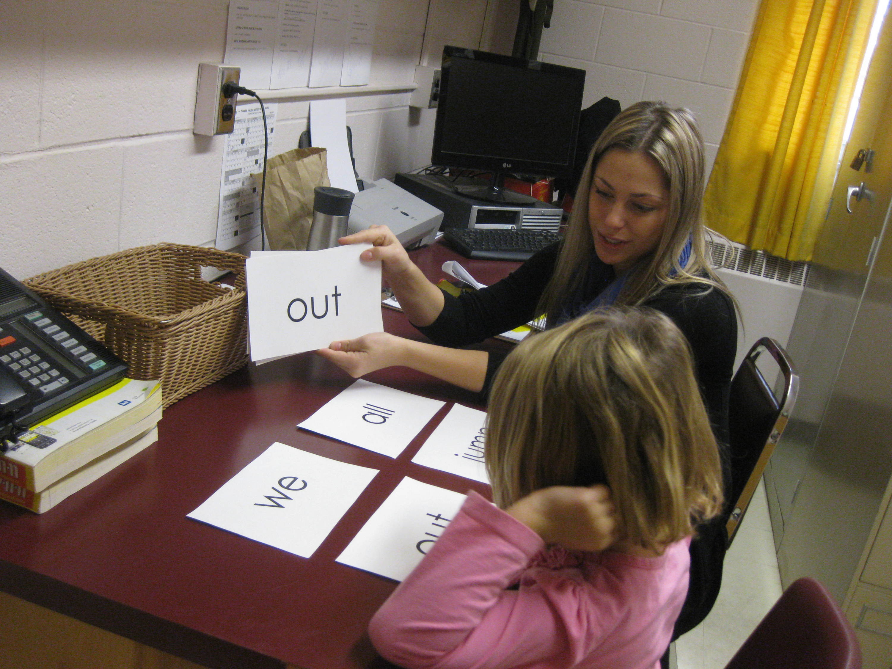 Photo of teacher and student with Eyeword cards