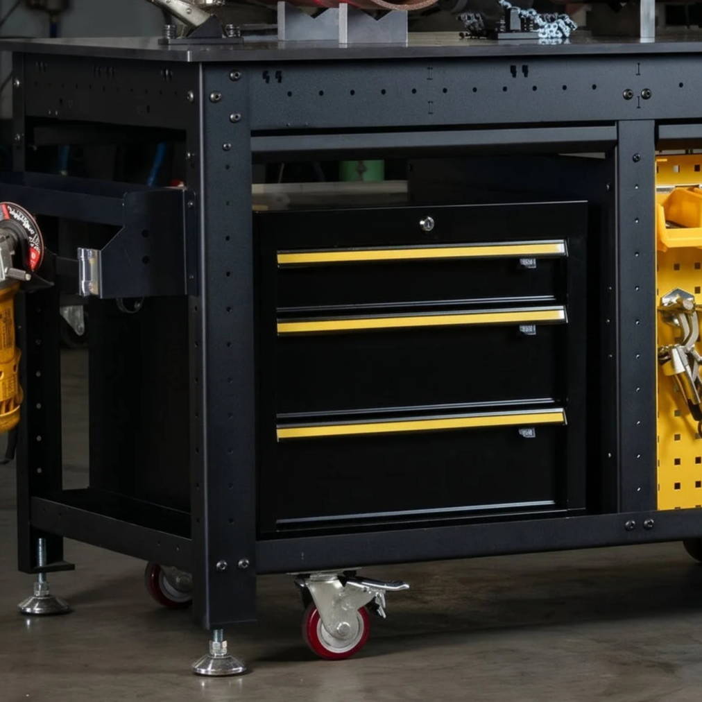 A workbench with tools, drawers, and metal pipes on top.