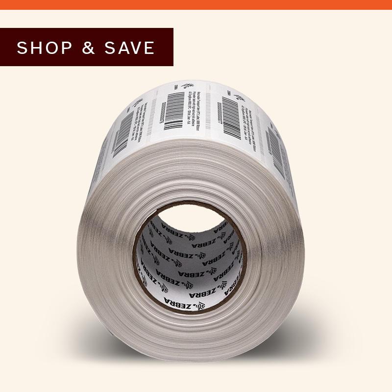 Roll of adhesive labels on a neutral background.