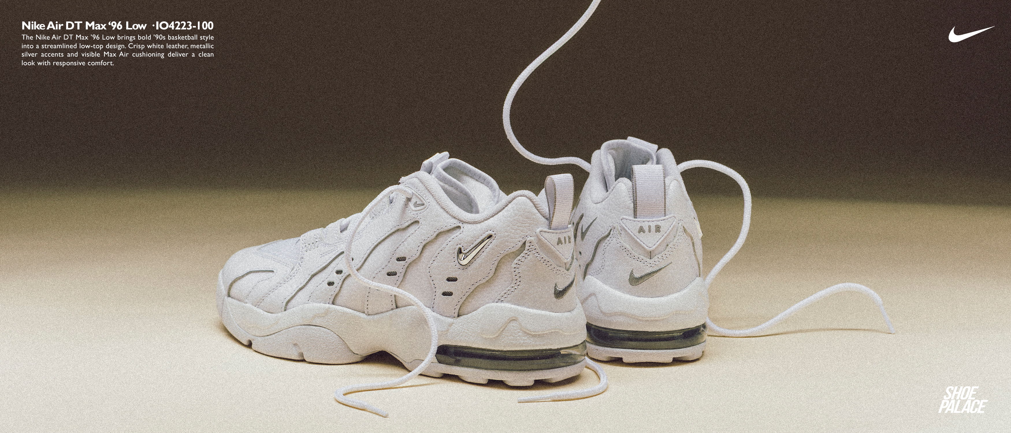 White Nike sneakers with laces, displayed against a neutral background.