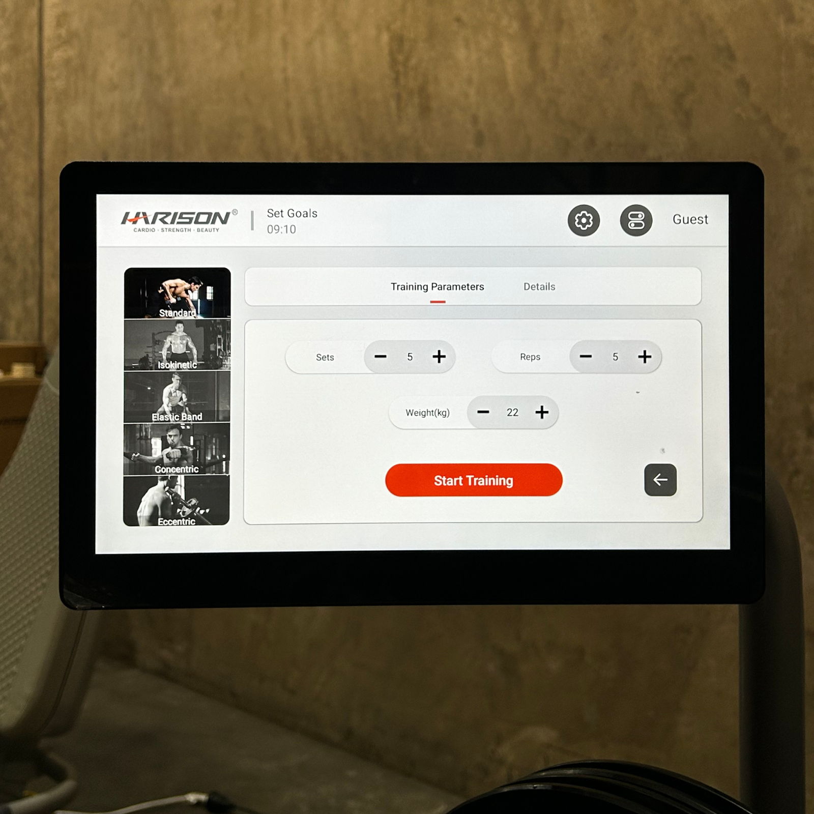 Tablet displaying a training interface with control options and a start button.