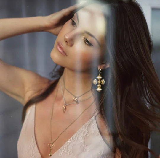 Stephanie Waxberg wears Soru Jewellery 24ct gold plated silver filigree Swarovski pearls large cross earrings
