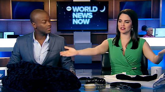 A still from the show ABC World News showing a man and woman discussing various sleep products