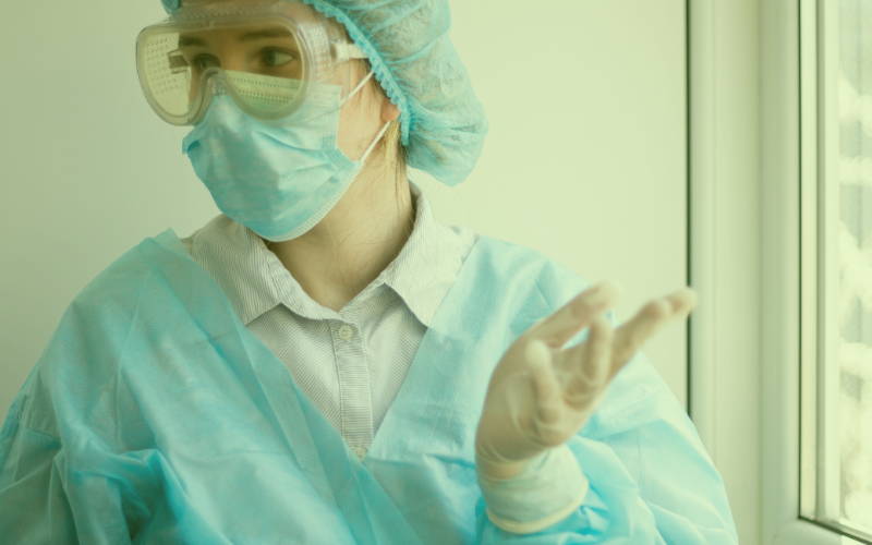 Doctor wearing a face mask and gloves