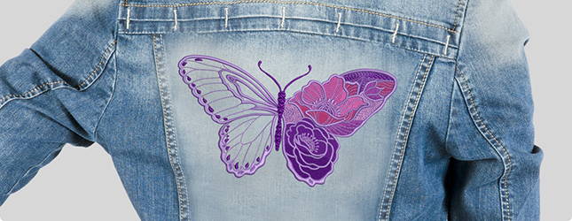 Butterfly embroidered on the back of a denim jacket