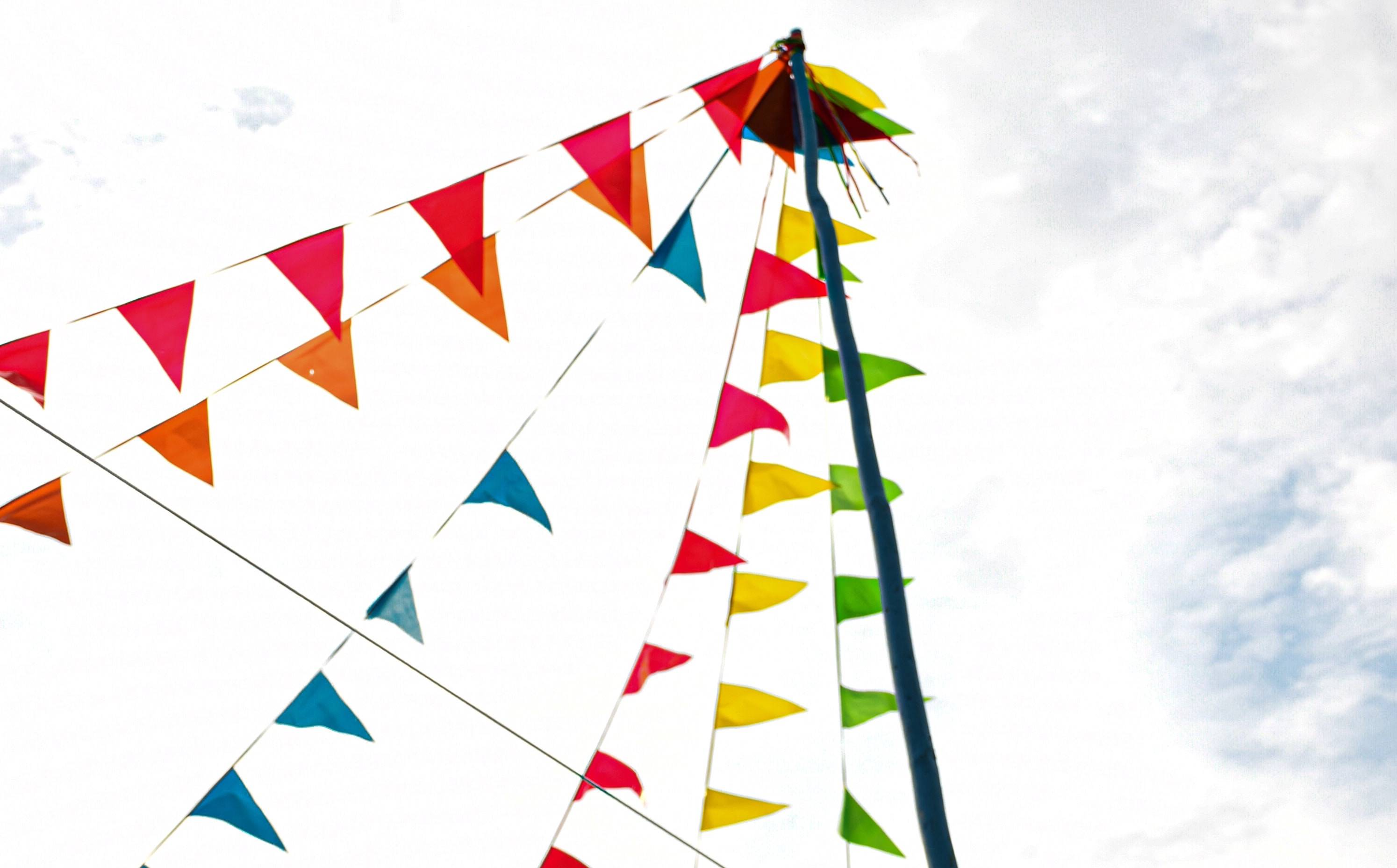 A image of multicoloured festival flags