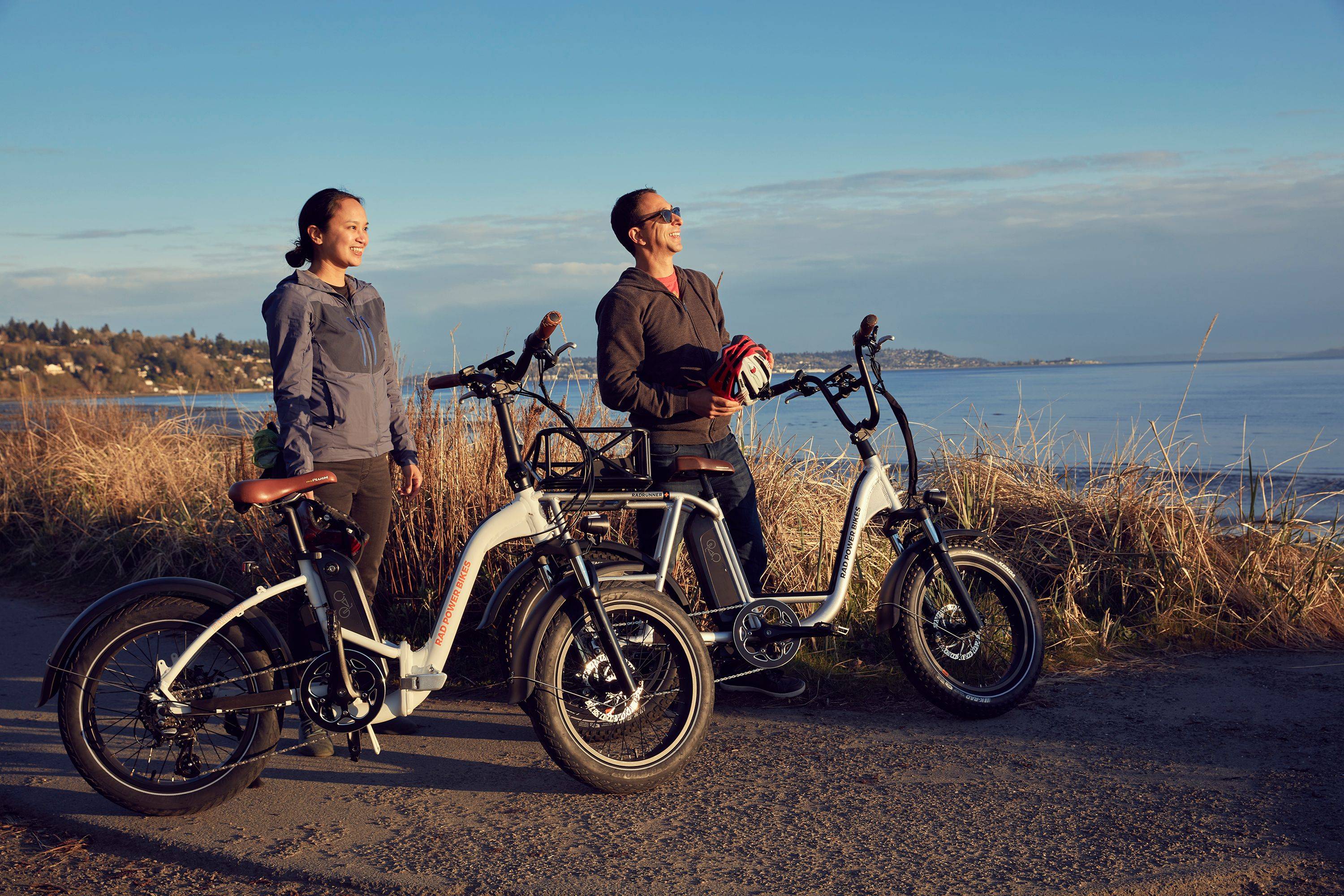 Two people with Rad Power Bikes electric bikes looking at an ocean view