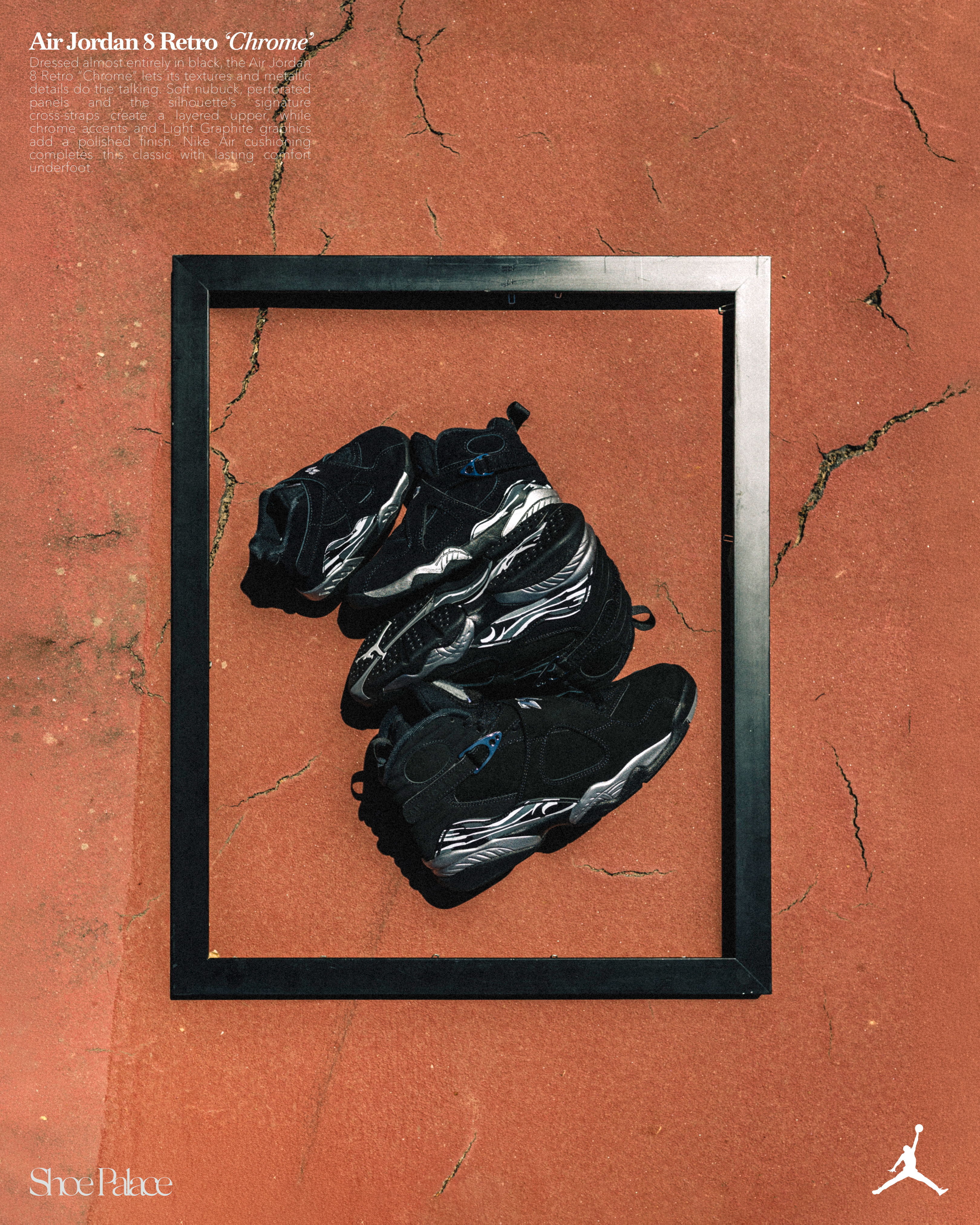 Black Air Jordan sneakers displayed in a framed arrangement on a textured surface.