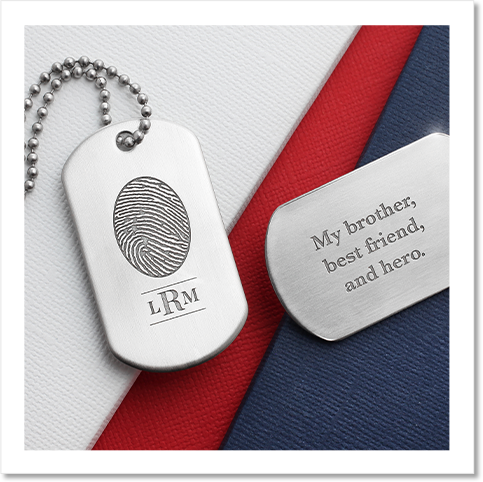Engraved military dog tag with a fingerprint, monogram, and inscription