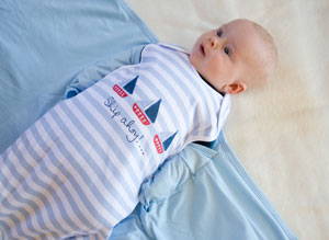 baby rolling but needs swaddle