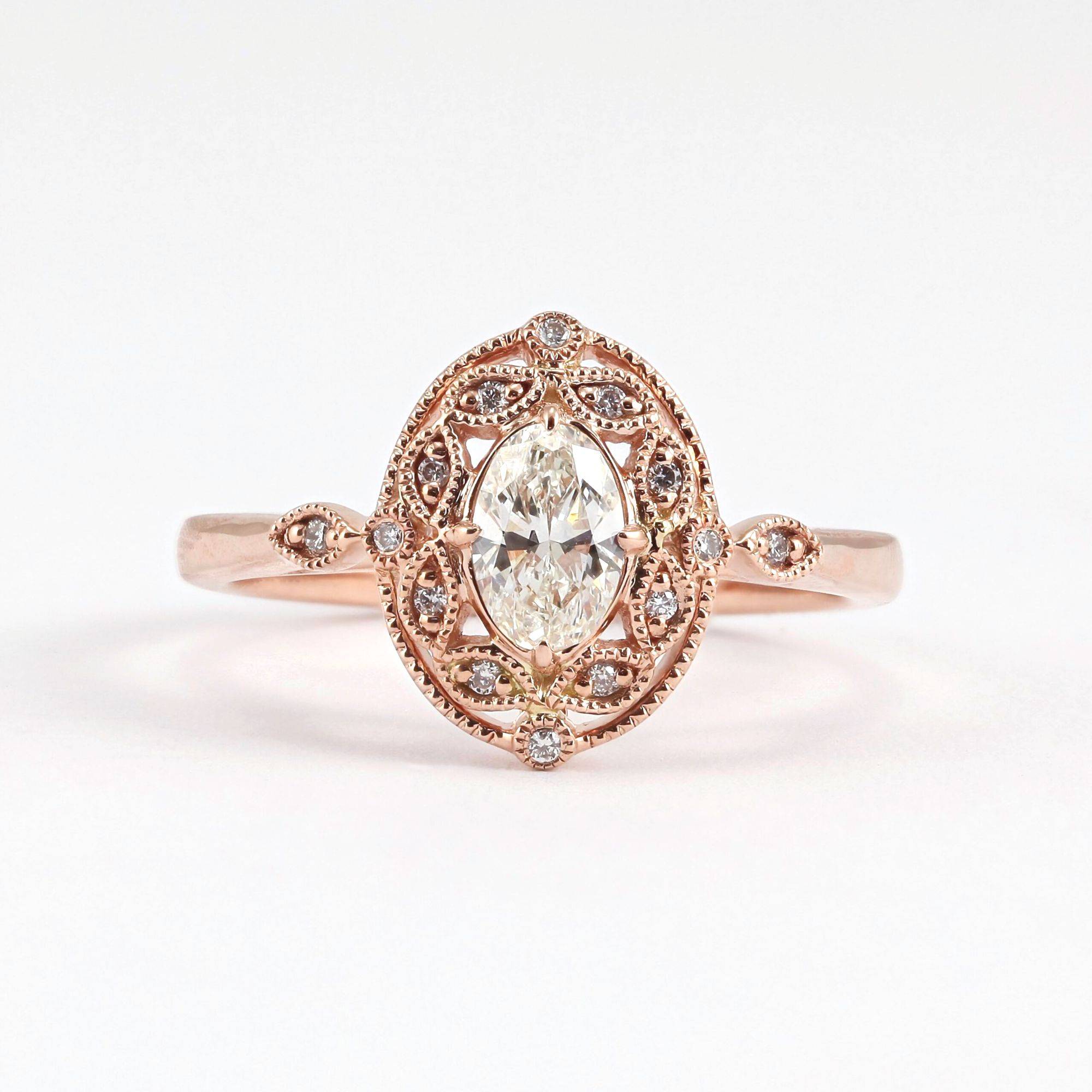 14K rose gold oval diamond engagement ring with milgrain and diamond halo