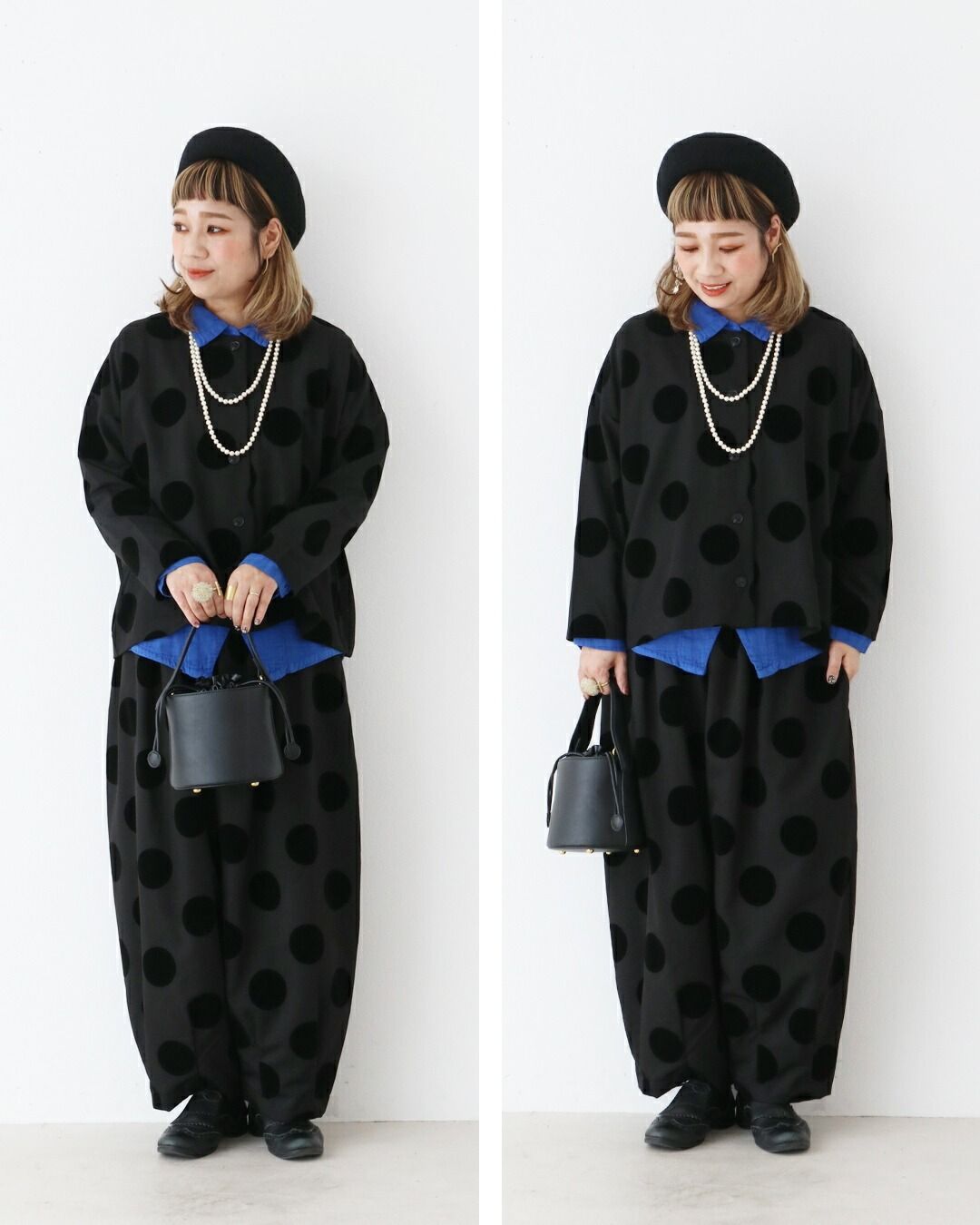 A woman in polka dot outfit poses with a handbag.