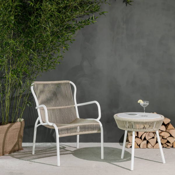 Powder coated aluminum lounge chair that is weaved with beige polypropylene rope