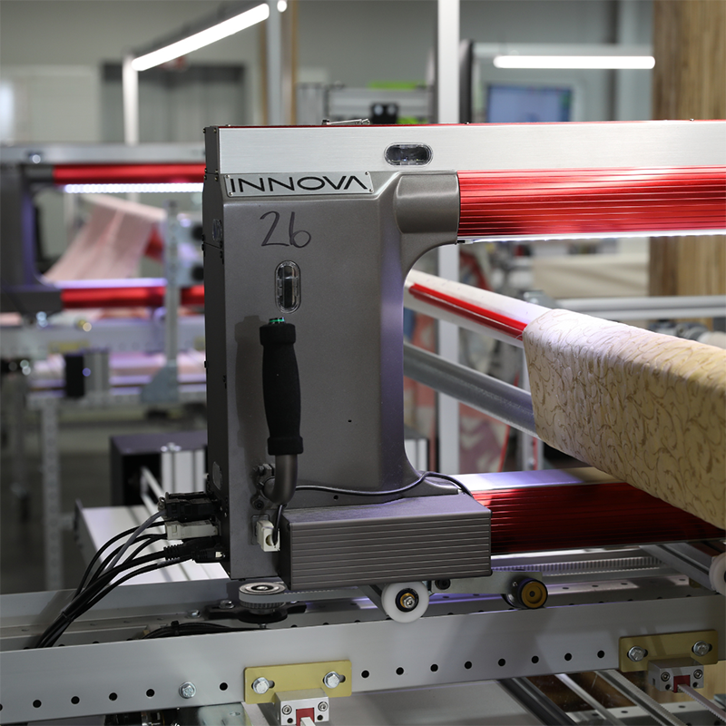 one of our state-of-the-art Innova longarm quilting machines