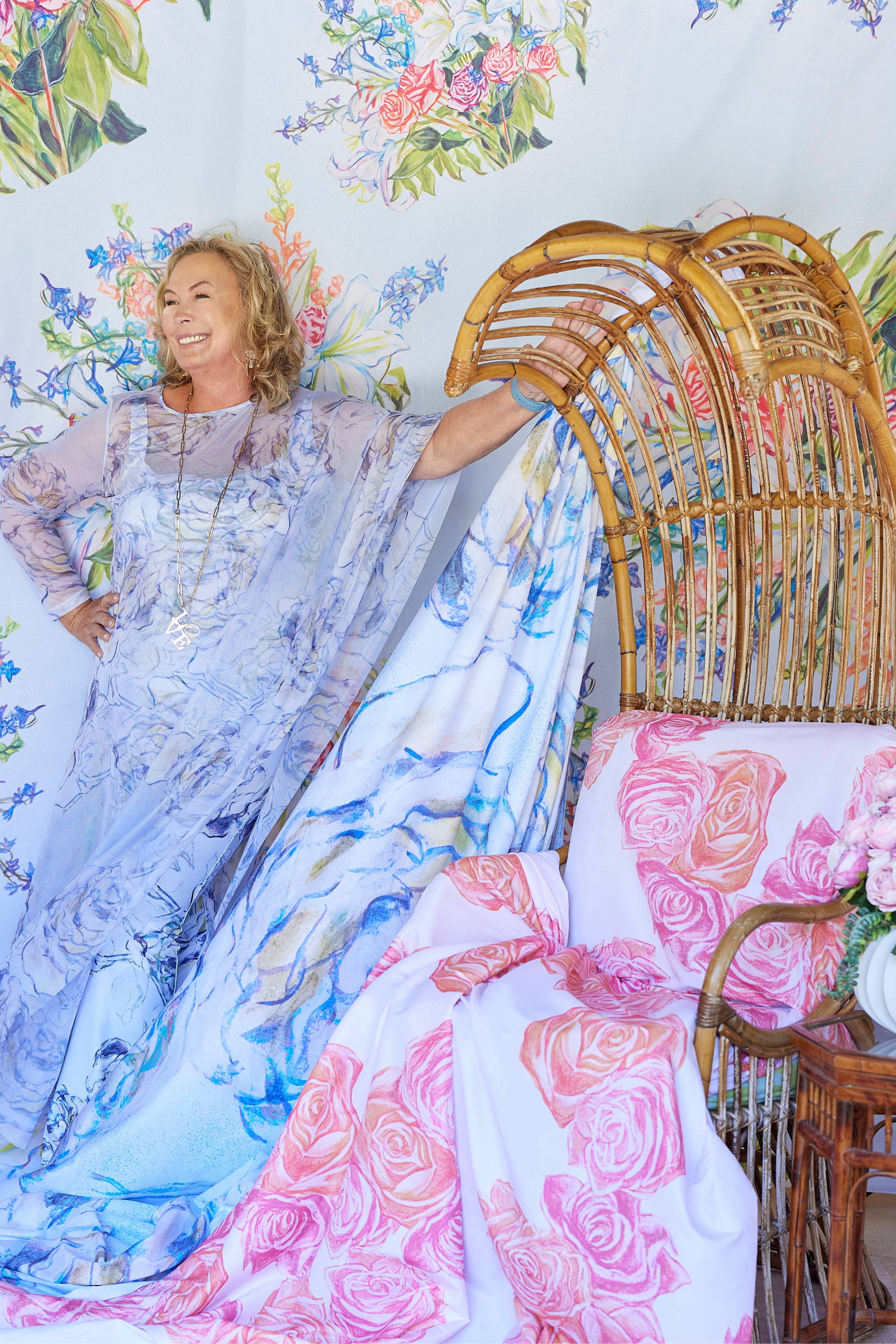 Ala Isham wearing blue rose printed mesh kaftan over matching stretch knit long dress at her house in Antigua