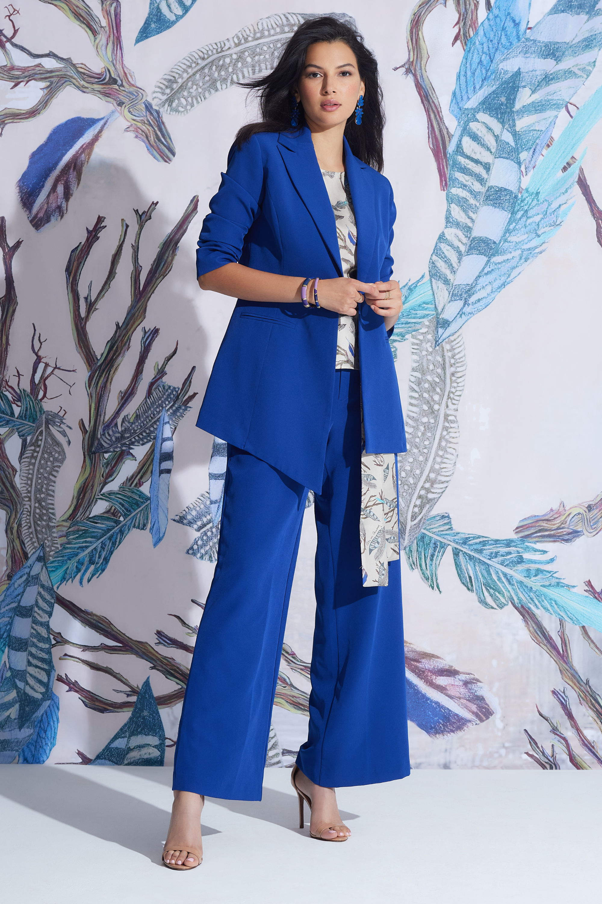 Woman wearing blue silk suit by designer Ala von Auersperg 