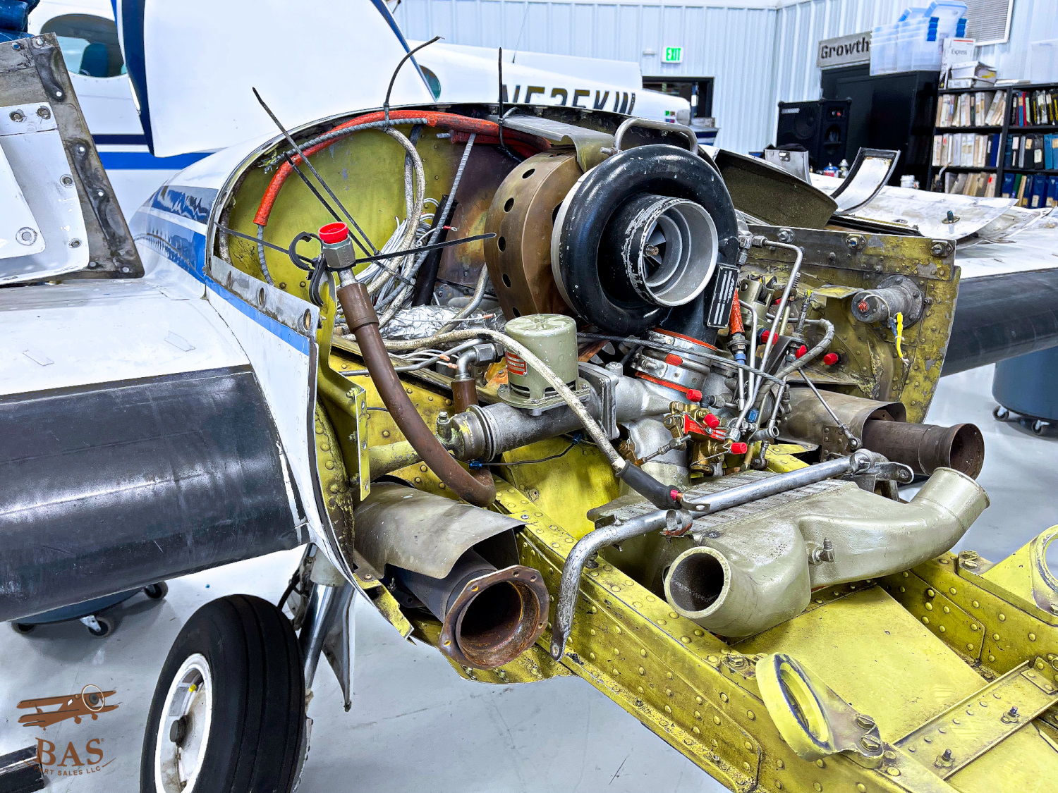 Cutaway view of an aircraft engine with visible components and wiring.