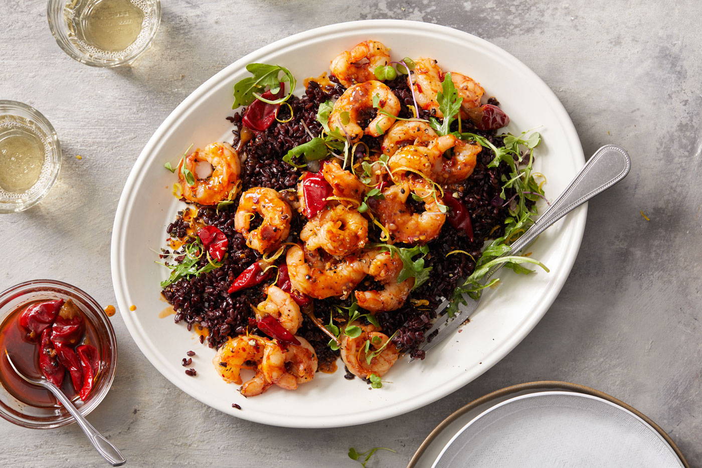 Black rice topped with shrimp and calabrian peppers