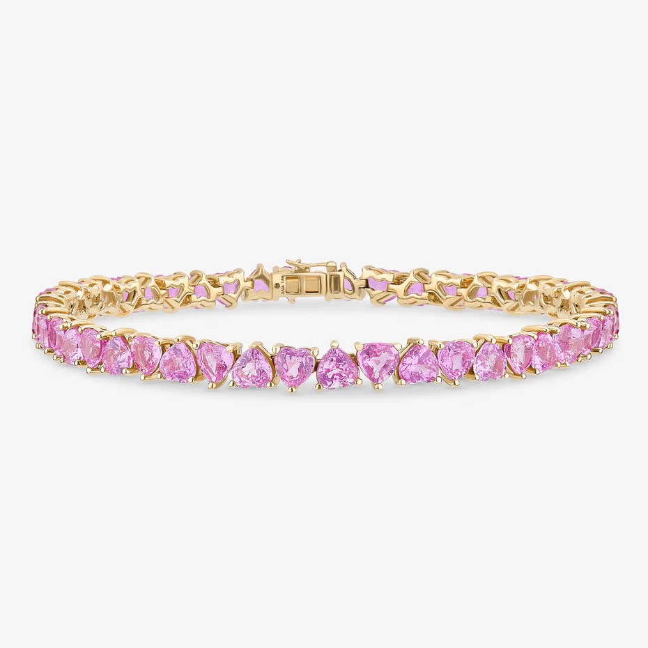 14k yellow gold tennis bracelet featuring heart-cut natural pink sapphires in a classic prong setting.