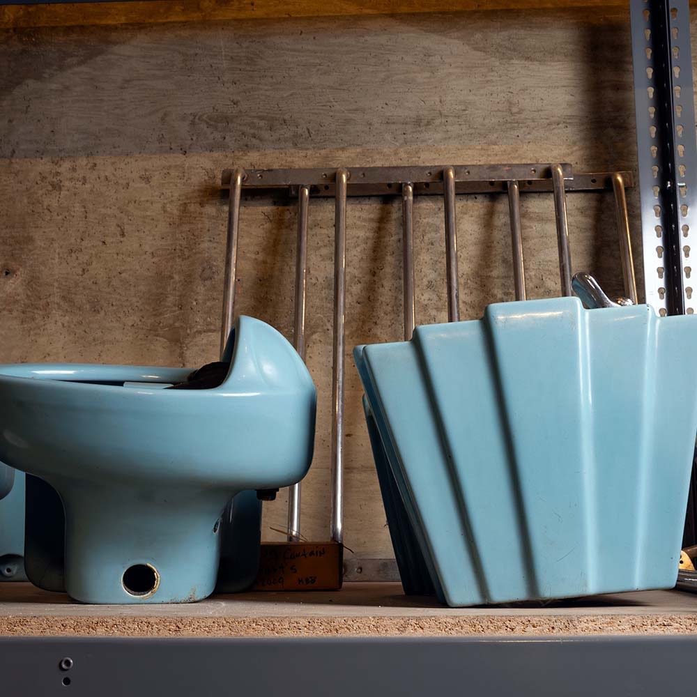 Pieces of vintage blue Art Deco plumbing fixtures in the archives of Los Angeles' Union Station.