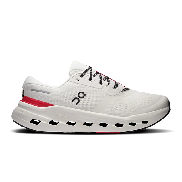White athletic shoe with red accents and black sole.