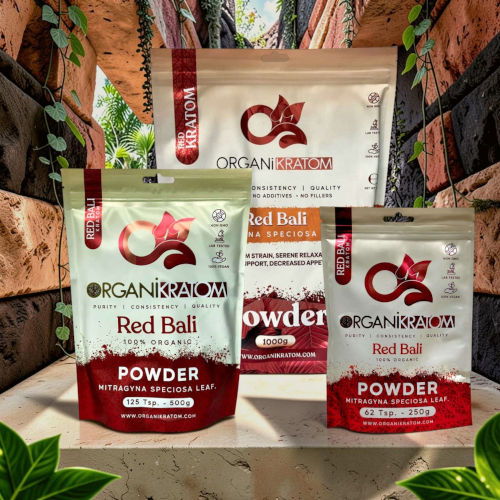 Bags of Red Bali powder on a decorative background with plants.