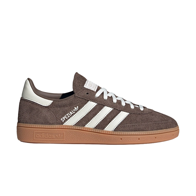 Brown Adidas sneakers with white stripes and gum sole.