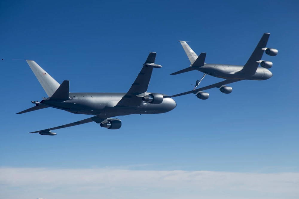 Photos of Boeing's KC-46A, left, conducting tests of aircraft acceleration and vibration exposure while flying in receiver formation at various speeds and altitudes behind either the KC-10 Extender or the KC-135 Stratotanker. Testing for this phase was coordinated from Edwards Air Force Base, Calif., and conducted above Owens Valley and parts of the western Mojave Desert.