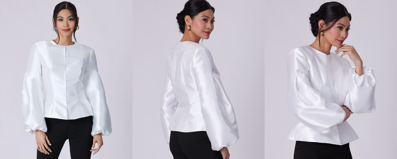 Model showcasing a white blouse from multiple angles.