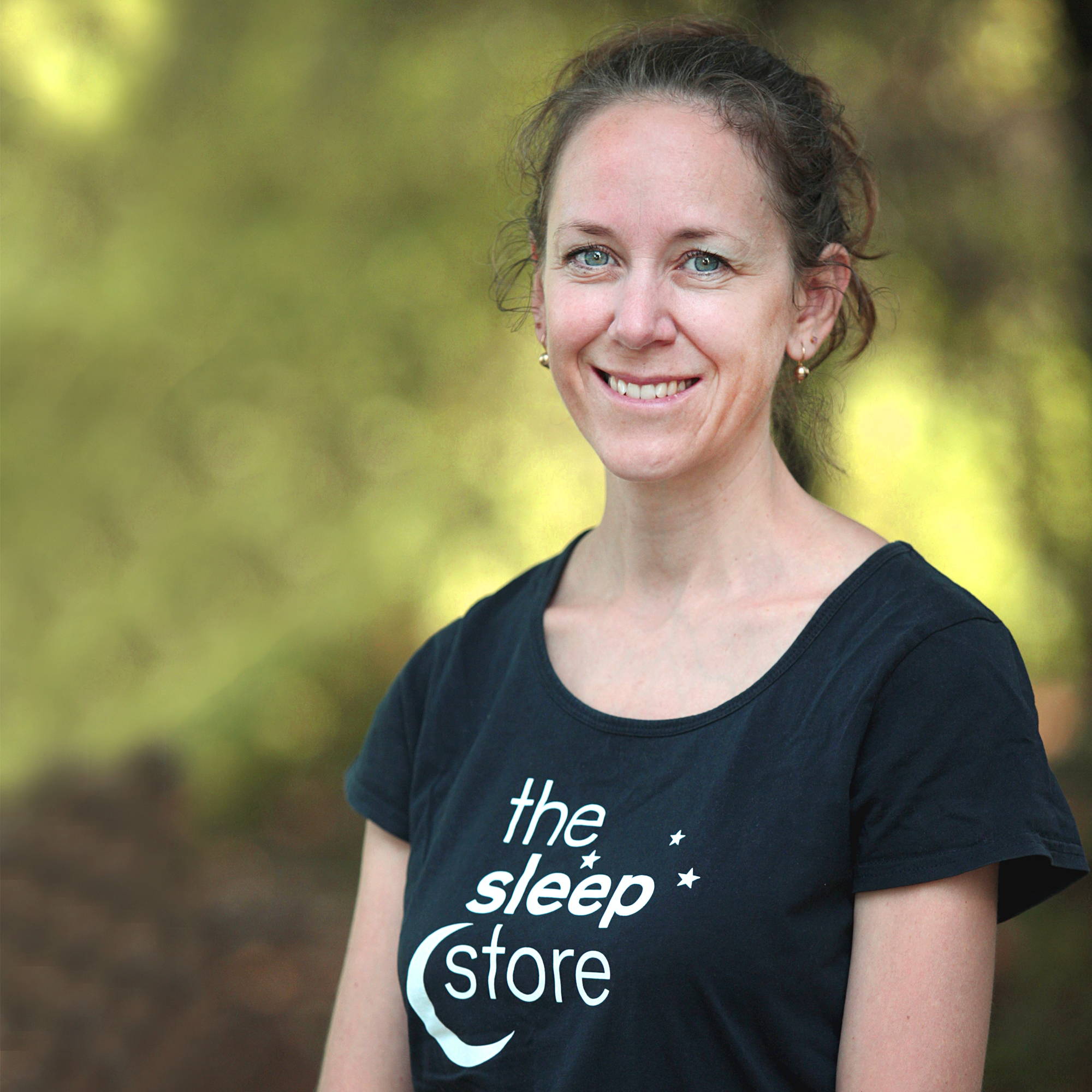 the sleep store customer service woman in sleep store t-shirt smiling
